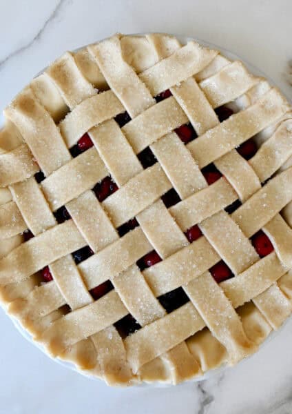 Woven lattice pie crust before baking.